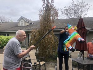 Man swinging at pinata