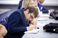 Student taking notes