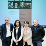Image of presenters at lecture.