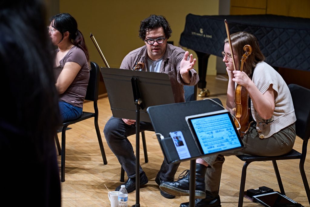 The Attacca Quartet works with string students in a masterclass