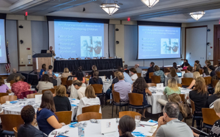 Audience facing speaker at University Autism Summit