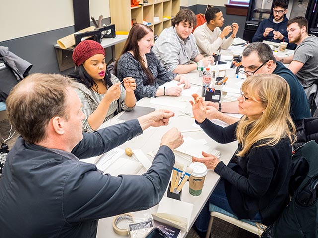 Iain Kerr leads a class in the lab.