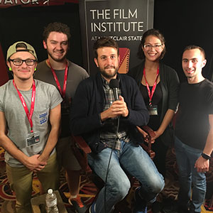 Shilowich poses with students (l to r, surrounding Shilowich) Asher Sosinsky, Nicholas Calisti, Melanie St. Clair and Nich Marchese.
