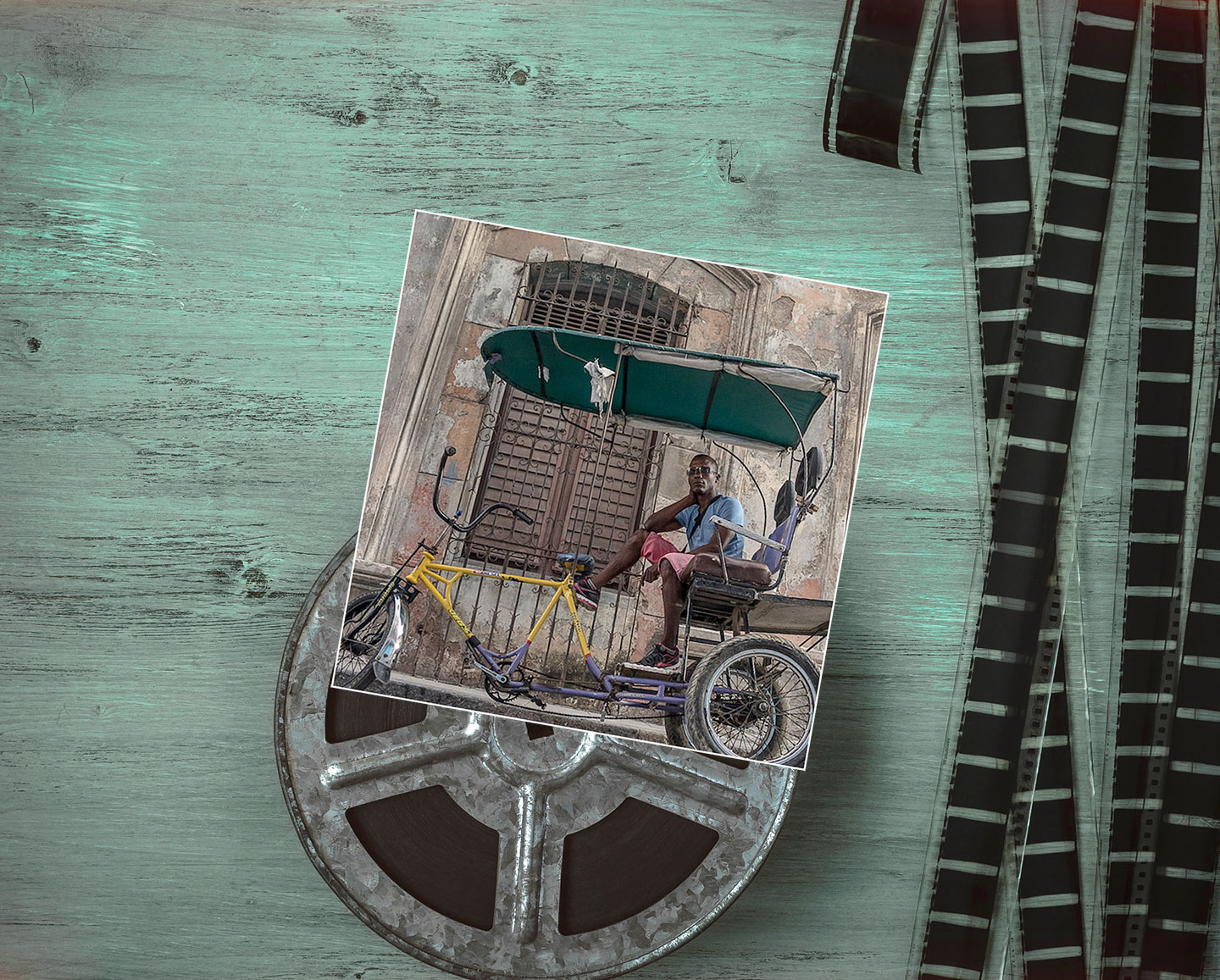 Photo of man in pedicab in Cuba overlay background image of film roll.