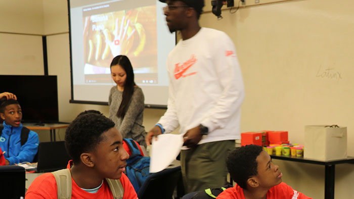 Student mentors with middle school boys in Newark.