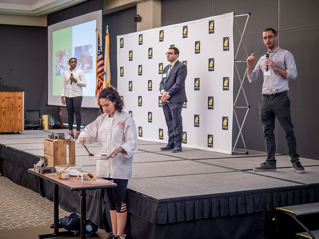Daphne Titus-Glover, David McDougall and Will Krupka. Kayla Abella helps out with a cooking demo.