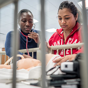 Nursing students with dummy
