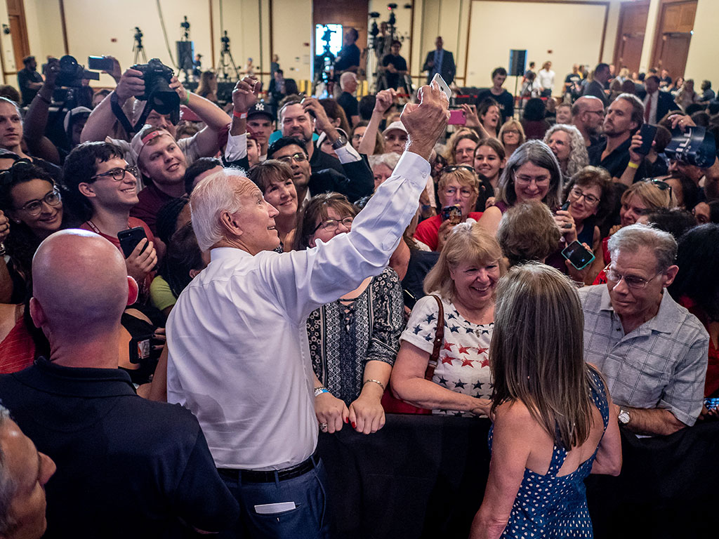 Vice President Joe Biden takes a selfie with students and fans