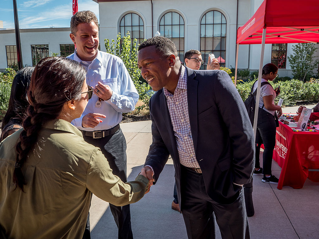 David Hood greeting student