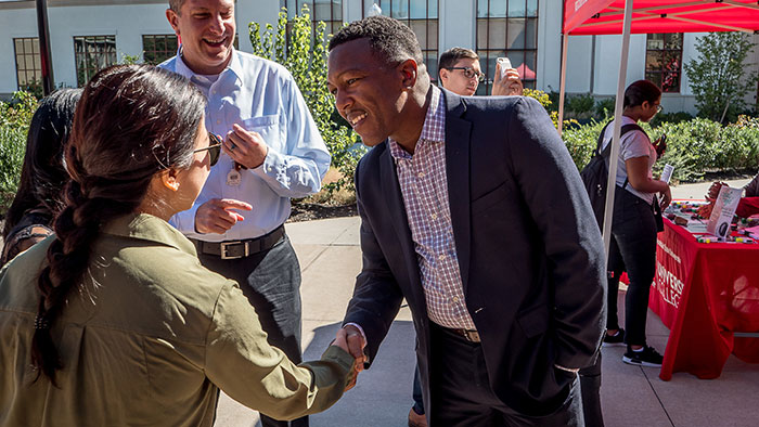 David Hood greeting student