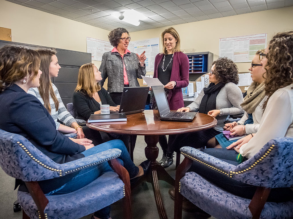 Jennifer Urban (standing, right) and Miriam Linver codirect the Institute for Research on Youth Thriving and Evaluation.