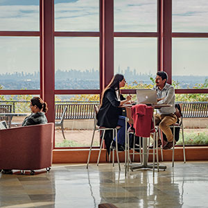 Students sitting in CELS overlooking skyline