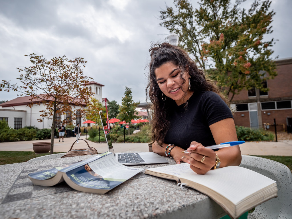 Female student writing in notebook