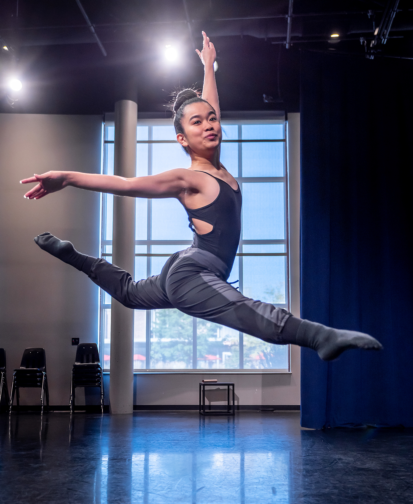 Nicole Arakaki leaping in the air