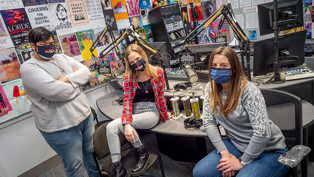 Joshua Tirado and Kaya Maciak brought home individual national broadcasting awards. They are seen here with General Manager Anabella Poland, right, in a rare moment together in the studio.
