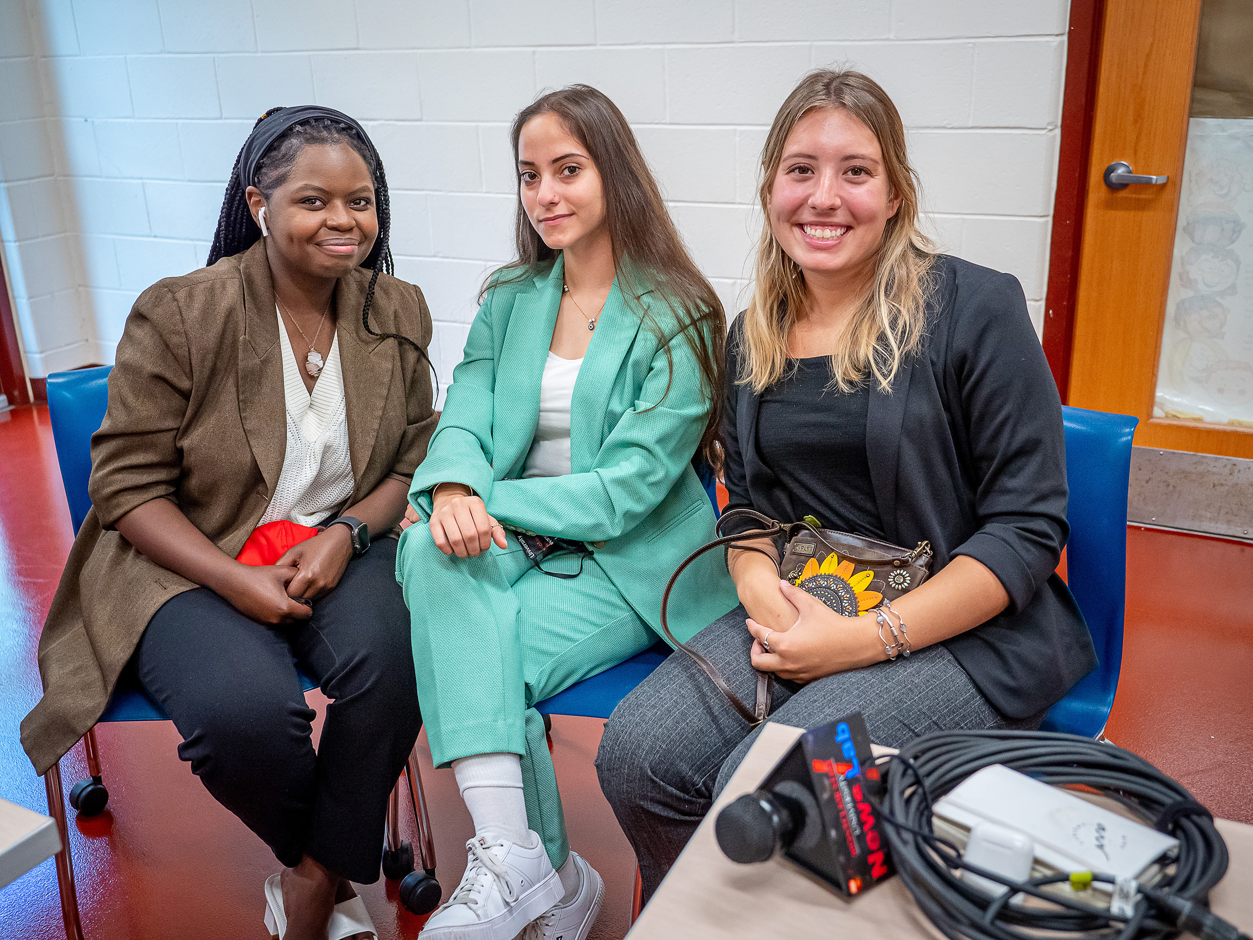 Student journalists, from left, Bernice Ndegwa ’23, Yazemin Yilmaz ’24 and Samantha Nungesser ’22