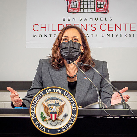 Vice President Kamala Harris seated at lectern