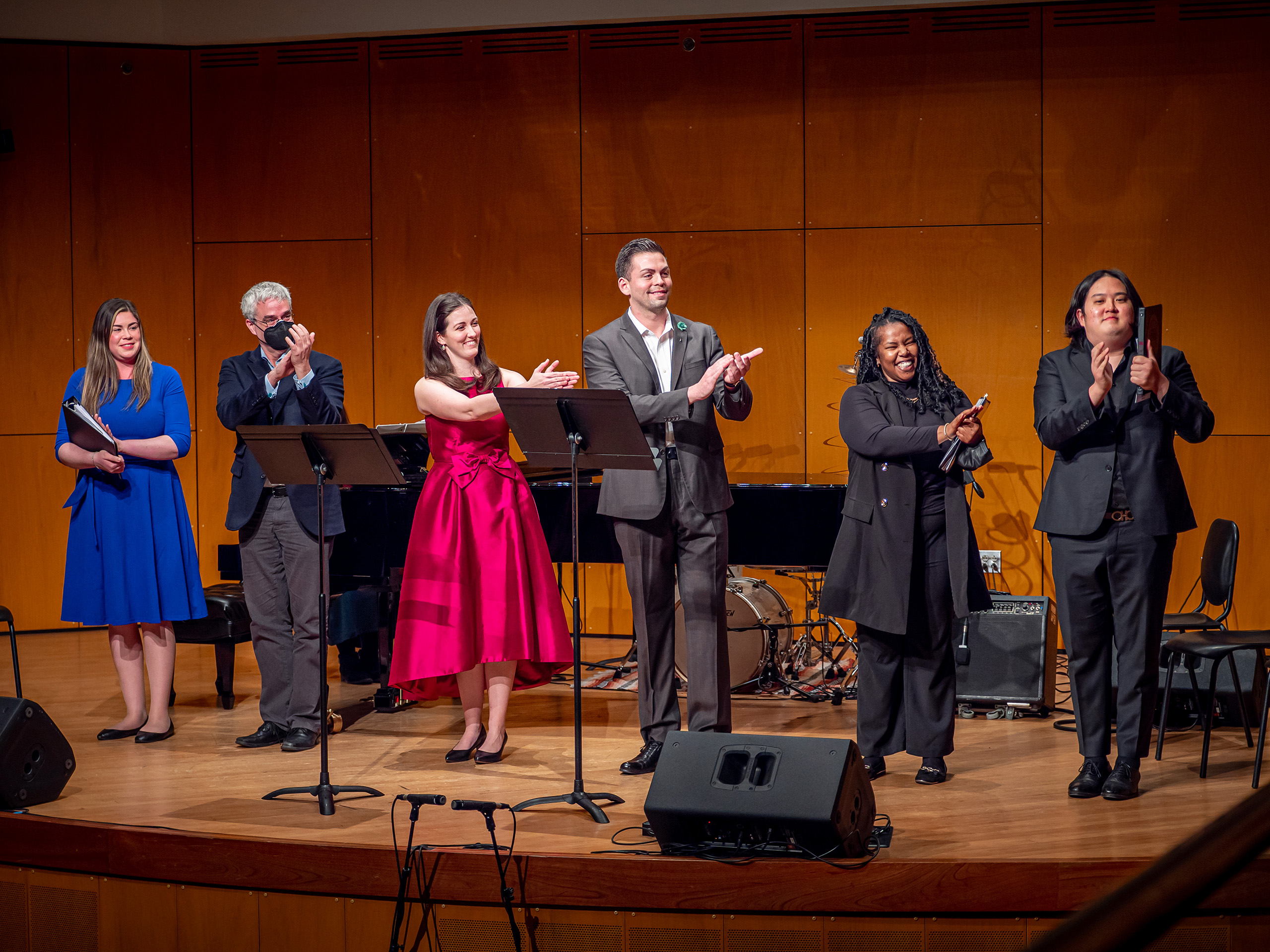 Musicians clapping on stage