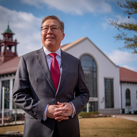 Photo of Montclair State University Provost Junius J. Gonzales in front of Cole Hall