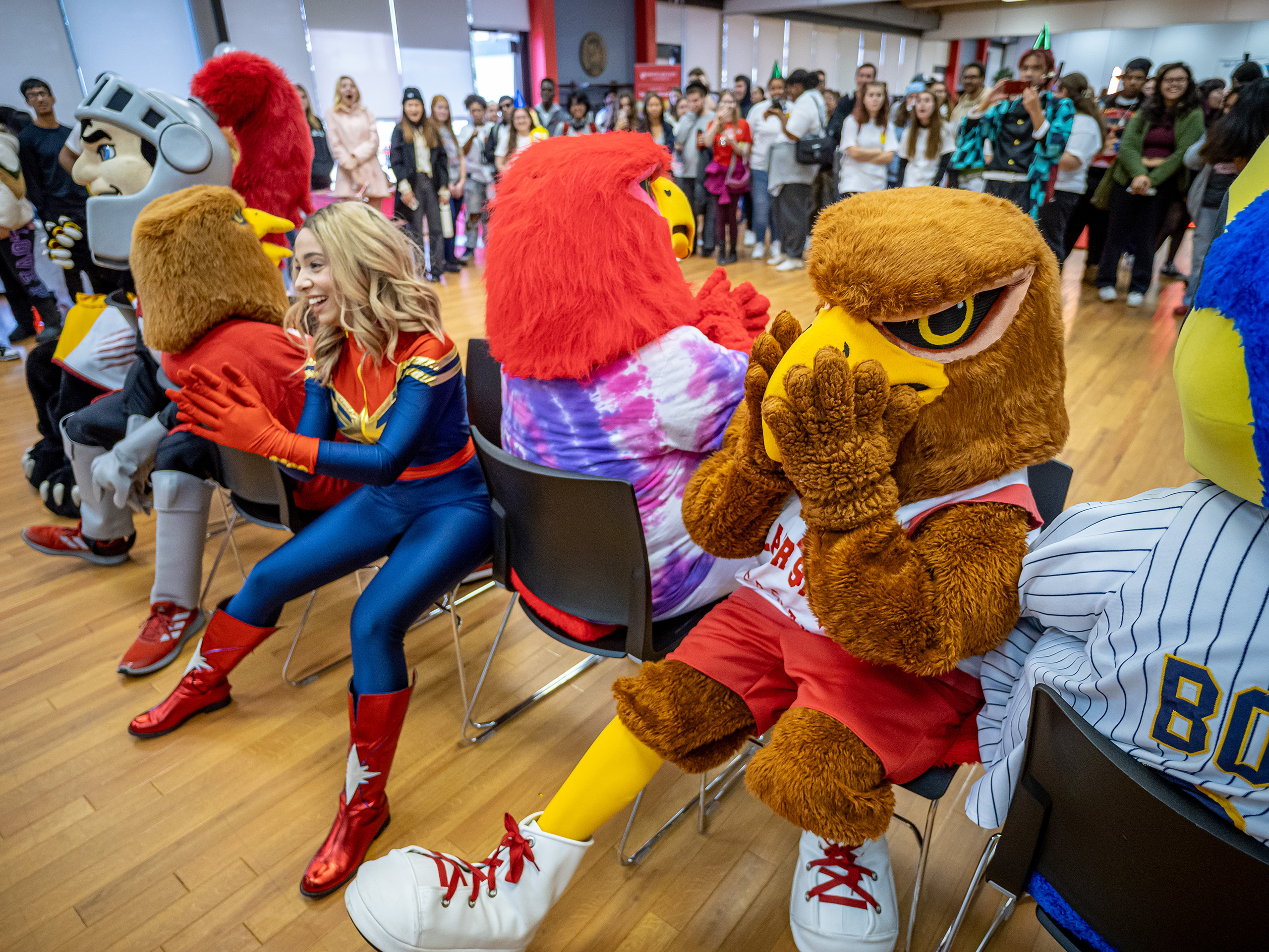 Rocky and other mascots in chairs