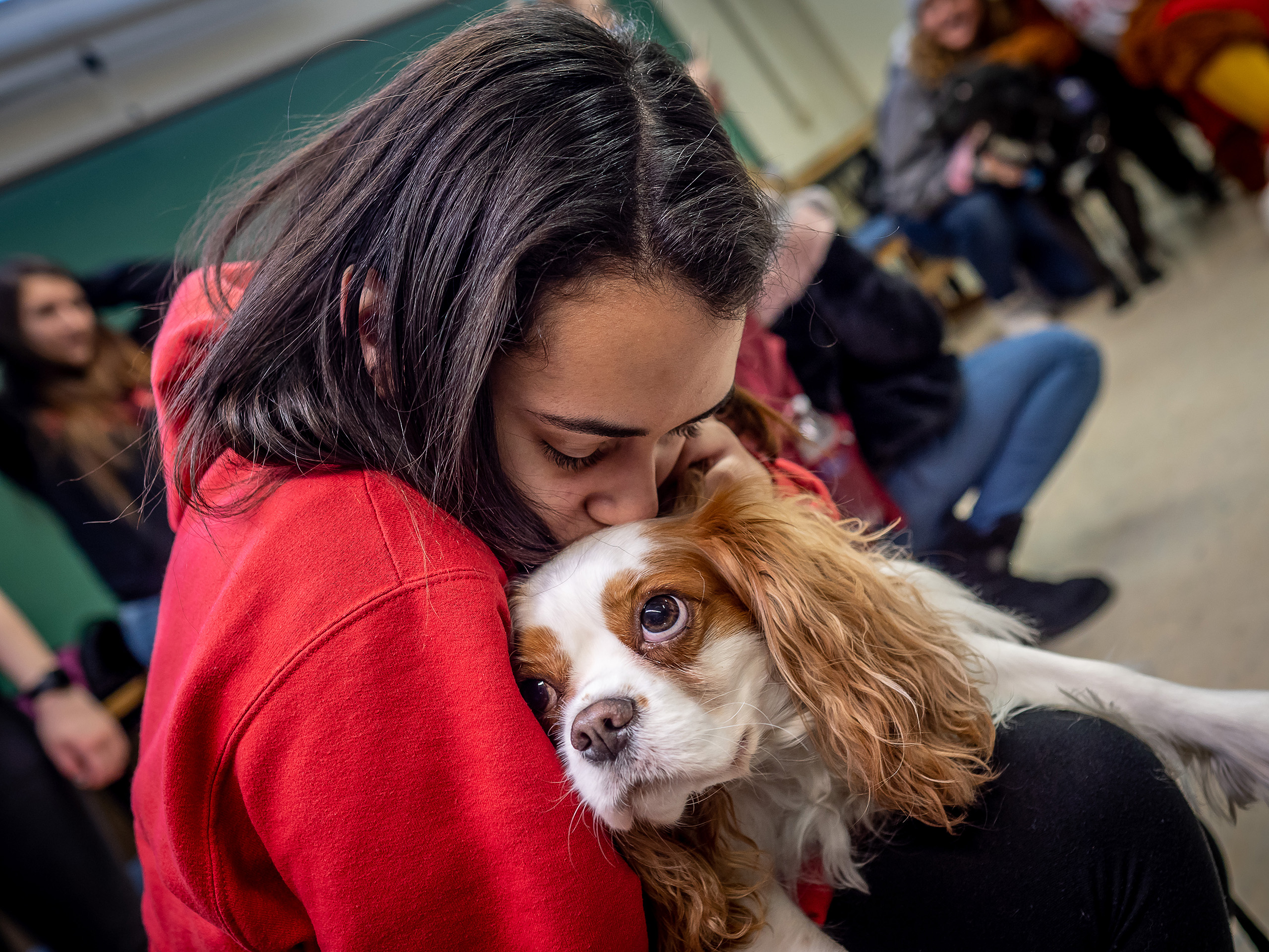 montclair student holding puppy