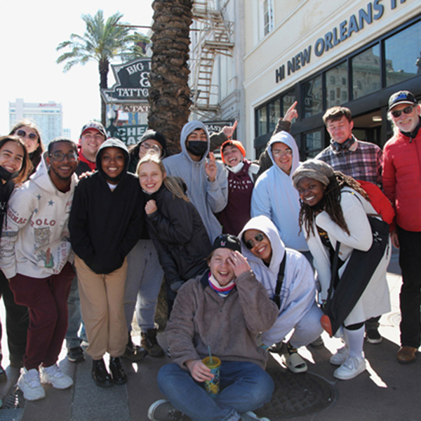 Steve McCarthy and group of students smiling for camera in New Orleans