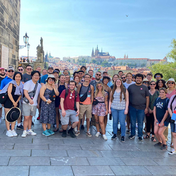 Group of musicians pose in the city of Prague