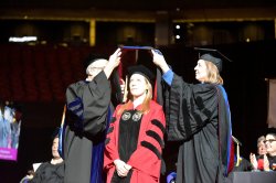 Photo of a PhD student during graduation ceremony