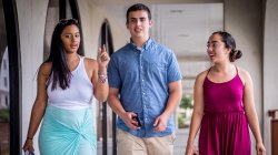 Photo of students walking along Kasser Theater breezeway
