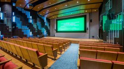 presentation theater in the School of Communication and Media showing a green-band movie trailer