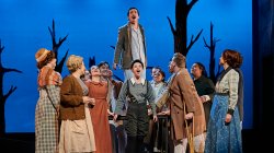 Stage production cast members singing
