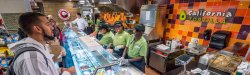 Photo of students placing orders at California Tortilla in the student center dining hall