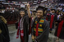 Students in caps and gowns at graduation