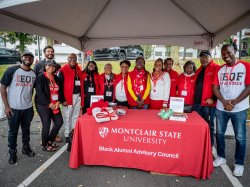 Members of the Black Alumni Advisory Council pose behind their table