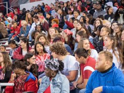 Students packed in tightly in stadium stands