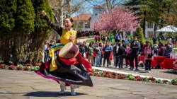 performer holding drum at World's Fair Day
