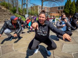 students dancing on campus