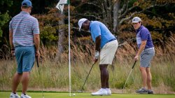 three men golfing