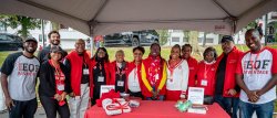 Group of alumni at Black Alumni Advisory Council tent