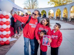 Parents and students in MSU wear at homecoming