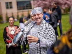 Man in traditional garb with tea