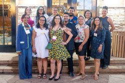 Hispanic Alumni pose at an event.