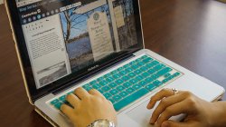 Image of a student working on a computer using story-map software.
