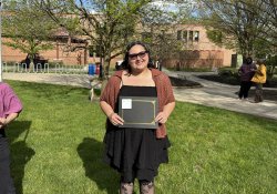 photo of anthropology student receiving award