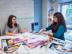 Student and instructor discussing Fashion Studies