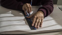 hands drawing a line