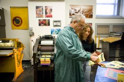 Instructor showing student printing techniques
