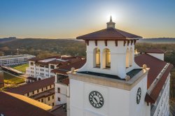 Aerial photo of campus with University Hall tower in foreground