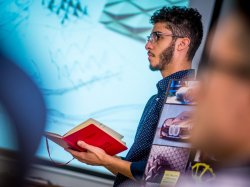Photo of student talking in a CART Industrial Design classroom