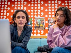 Header image of professor and a student working together